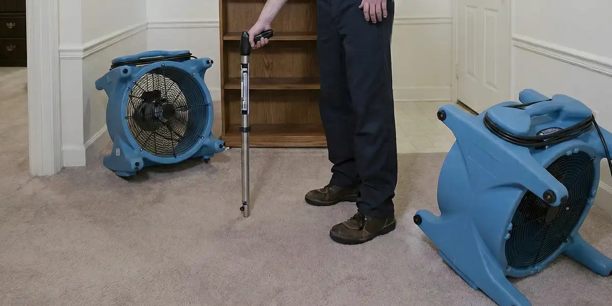 emergency water removal equipment deployed to dry a flooded residential interior in Ogden, UT