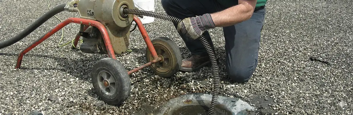 sewer rodding technician actively removing blockages from a sewer line in Ogden, UT